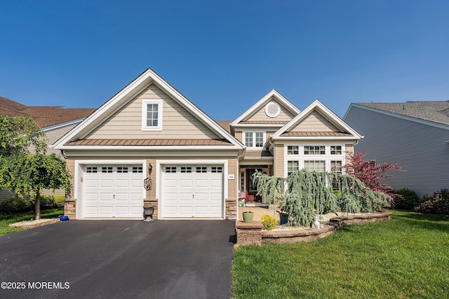 100 Arborridge Dr, Forked River, NJ 08731 - view of front of house featuring a standing seam roof, asphalt driveway, a front lawn, metal roof, and stone siding