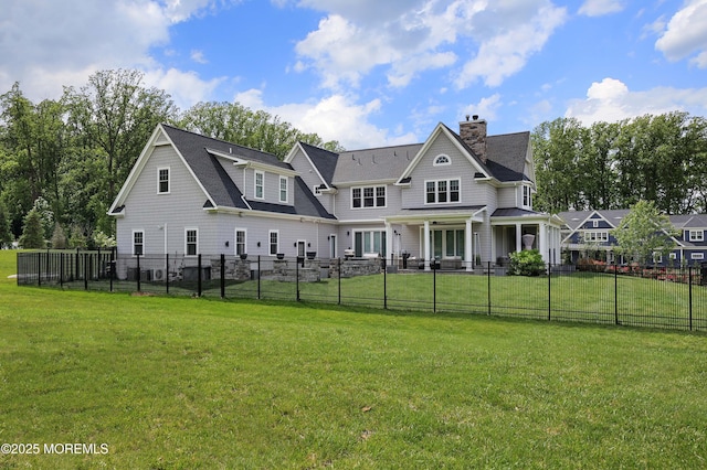 5 Buchop Ln, Red Bank, NJ 07701 - back of house featuring a fenced backyard, a chimney, and roof with shingles
