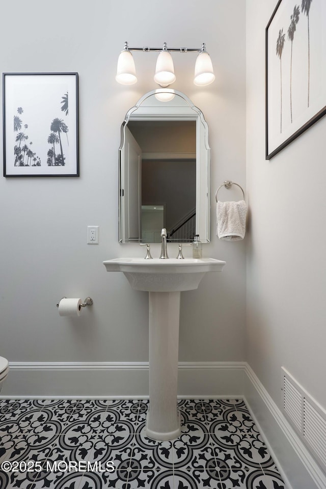 5 Buchop Ln, Red Bank, NJ 07701 - half bathroom featuring toilet and tile patterned flooring