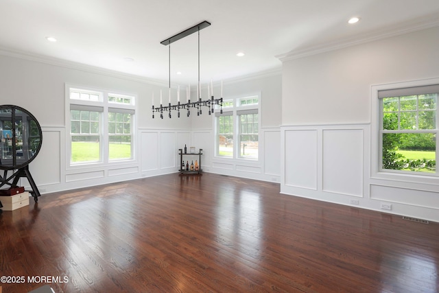 5 Buchop Ln, Red Bank, NJ 07701 - unfurnished living room featuring a decorative wall, plenty of natural light, ornamental molding, dark wood-type flooring, and wainscoting