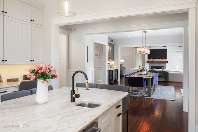 5 Buchop Ln, Red Bank, NJ 07701 - kitchen with dark wood-style flooring, open floor plan, light stone countertops, and decorative light fixtures