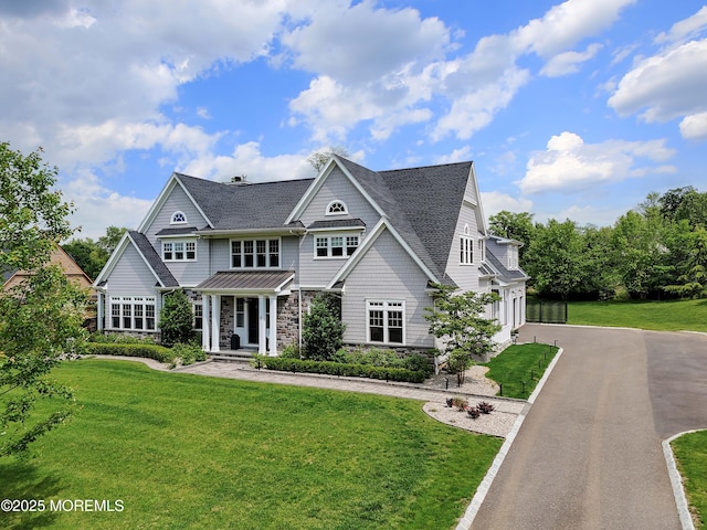 5 Buchop Ln, Red Bank, NJ 07701 - shingle-style home with stone siding, asphalt driveway, an attached garage, and a front yard