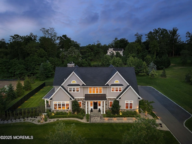 5 Buchop Ln, Red Bank, NJ 07701 - view of front facade featuring stone siding, asphalt driveway, and a chimney