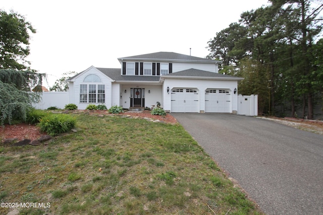 132 Sloop Rd, Manahawkin, NJ 08050 - traditional home featuring an attached garage and asphalt driveway