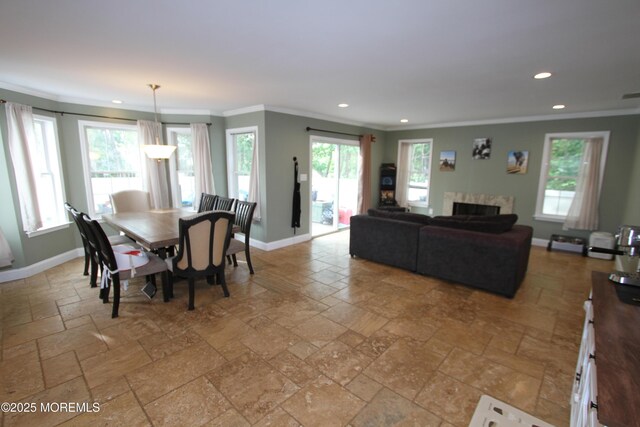 132 Sloop Rd, Manahawkin, NJ 08050 - dining room with stone tile flooring, ornamental molding, recessed lighting, baseboards, and plenty of natural light