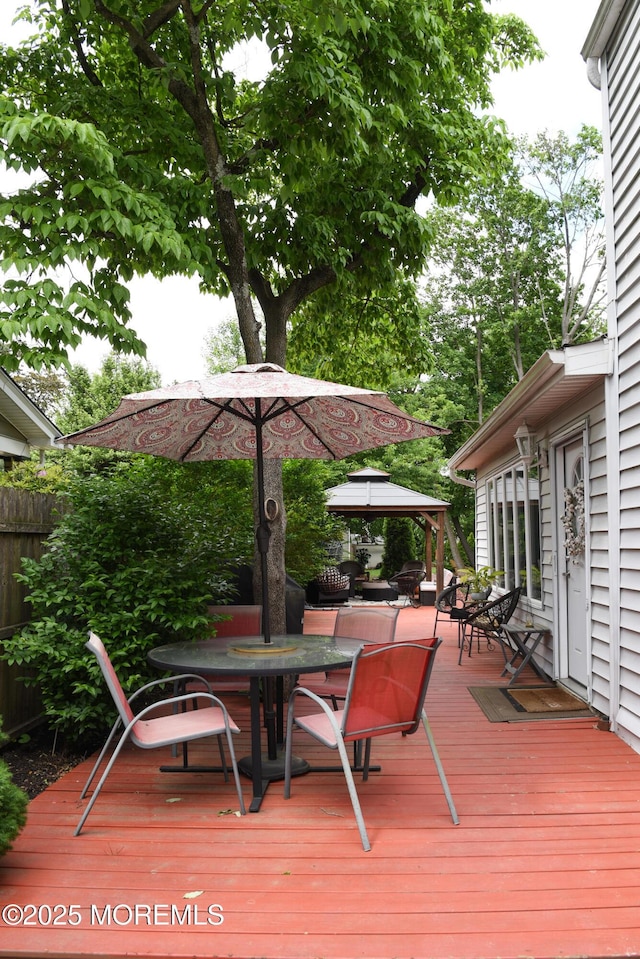 202 Main St, Matawan, NJ 07747 - wooden terrace featuring a gazebo and outdoor dining area