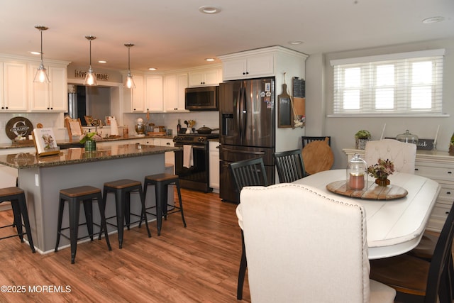 202 Main St, Matawan, NJ 07747 - dining room with wood finished floors and recessed lighting