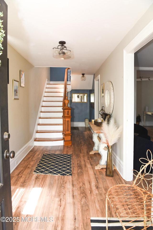 202 Main St, Matawan, NJ 07747 - entrance foyer featuring stairs, wood finished floors, and baseboards