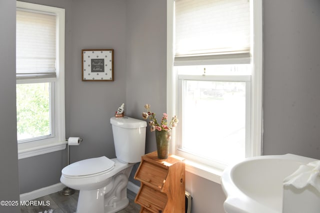 202 Main St, Matawan, NJ 07747 - bathroom with toilet, baseboards, and wood finished floors