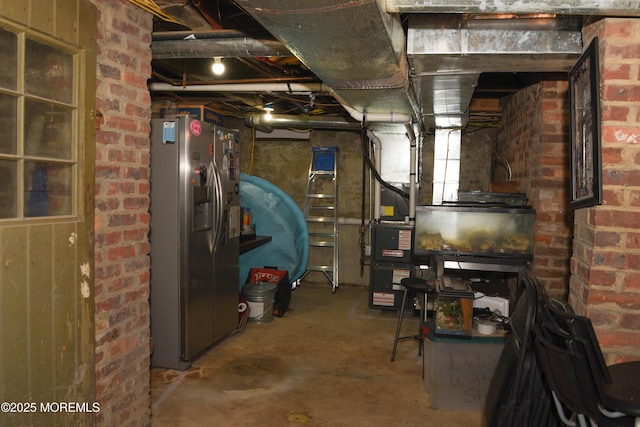 202 Main St, Matawan, NJ 07747 - unfinished below grade area featuring stainless steel fridge with ice dispenser and brick wall