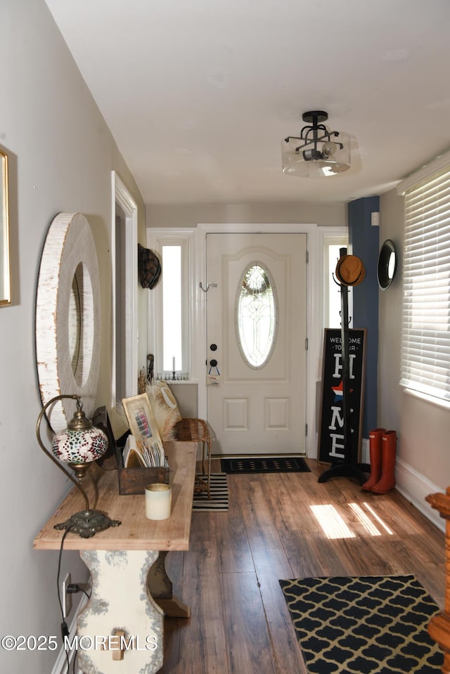 202 Main St, Matawan, NJ 07747 - foyer featuring dark wood-type flooring, healthy amount of natural light, and baseboards