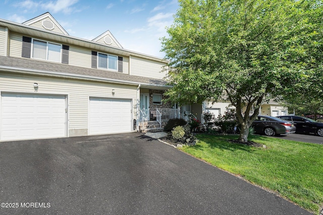 30 Forest Garden Dr, Matawan, NJ 07747 - view of property with a front lawn, driveway, a garage, and covered porch