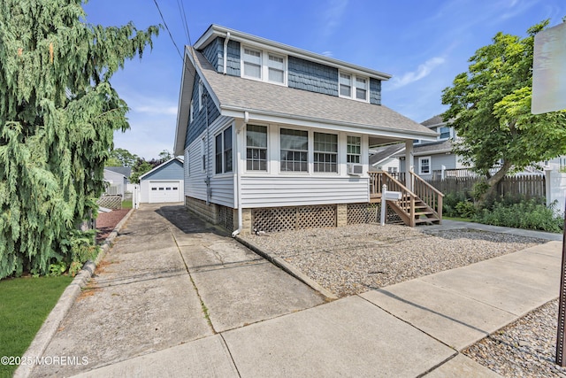 404 Saint Louis Ave, Point Pleasant Beach, NJ 08742 - view of front of property featuring a shingled roof, an outbuilding, a garage, and cooling unit