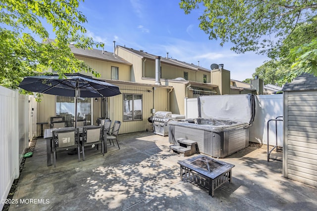 152 Redpine Loop, Old Bridge, NJ 08857 - fenced backyard with a hot tub, an outdoor fire pit, a patio, and outdoor dining space
