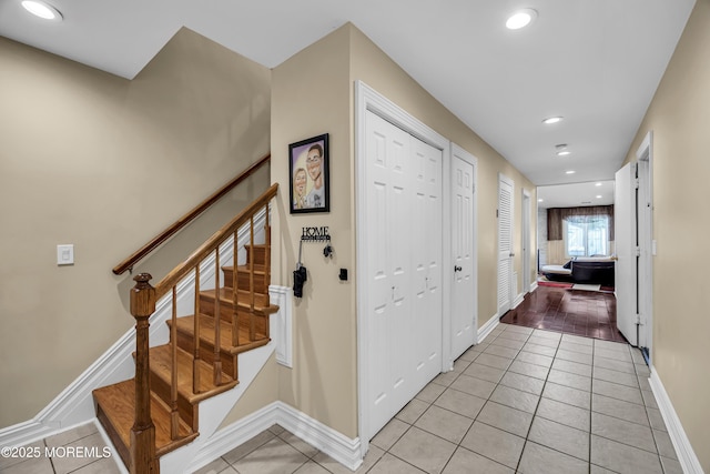152 Redpine Loop, Old Bridge, NJ 08857 - hallway featuring light tile patterned flooring, recessed lighting, stairs, and baseboards