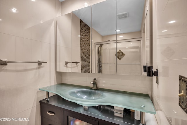 152 Redpine Loop, Old Bridge, NJ 08857 - full bathroom featuring tile walls, a stall shower, and vanity