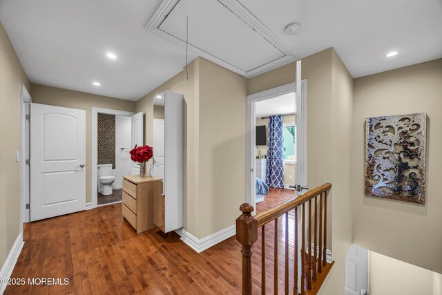 152 Redpine Loop, Old Bridge, NJ 08857 - corridor featuring attic access, wood finished floors, baseboards, recessed lighting, and an upstairs landing