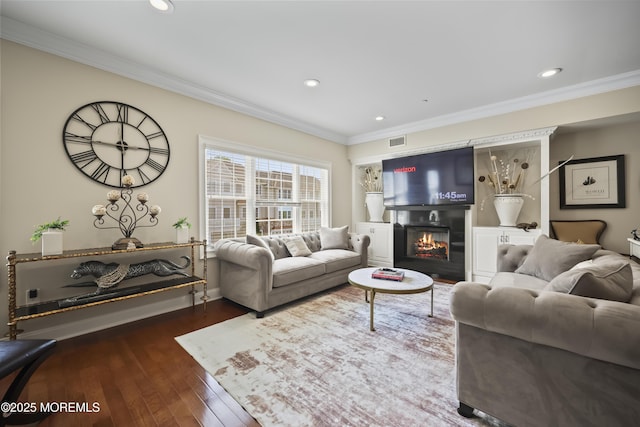 14 White Oak Ln, Aberdeen, NJ 07747 - living area with ornamental molding, dark wood-type flooring, a glass covered fireplace, recessed lighting, and baseboards