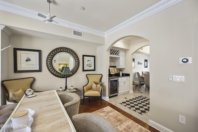 14 White Oak Ln, Aberdeen, NJ 07747 - living area with beverage cooler, ornamental molding, a ceiling fan, baseboards, and a dry bar