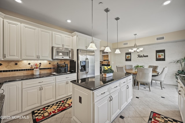 14 White Oak Ln, Aberdeen, NJ 07747 - kitchen featuring stainless steel appliances, light tile patterned floors, a chandelier, decorative backsplash, and decorative light fixtures