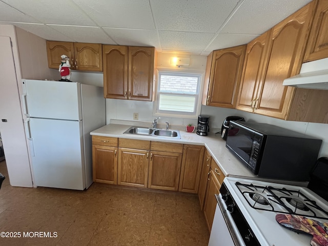7 Grace Ln, Howell, NJ 07731 - kitchen featuring white appliances, a sink, a drop ceiling, under cabinet range hood, and light countertops