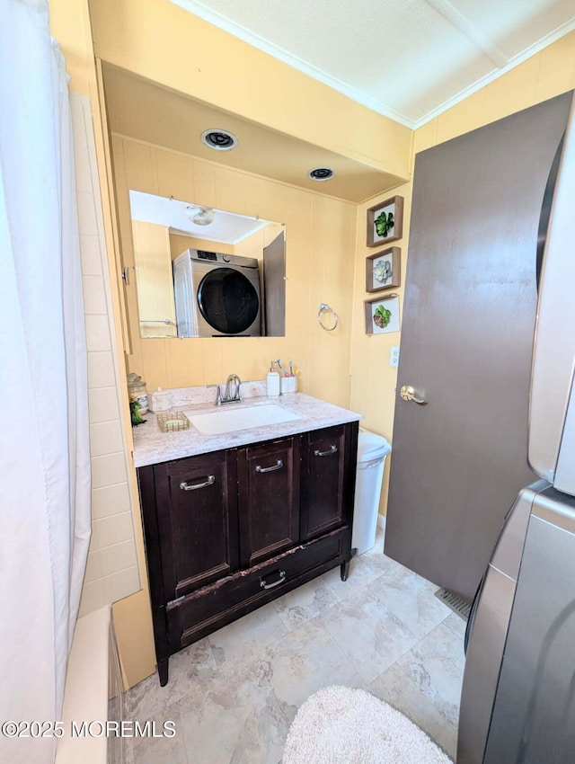7 Grace Ln, Howell, NJ 07731 - bathroom with toilet, crown molding, vanity, curtained shower, and estacked washer and dryer