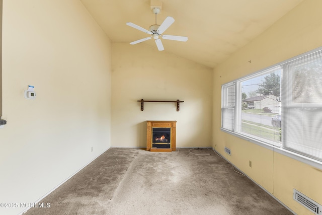 13 Copper Ln, Hazlet, NJ 07730 - unfurnished living room featuring carpet floors, a lit fireplace, a ceiling fan, and vaulted ceiling
