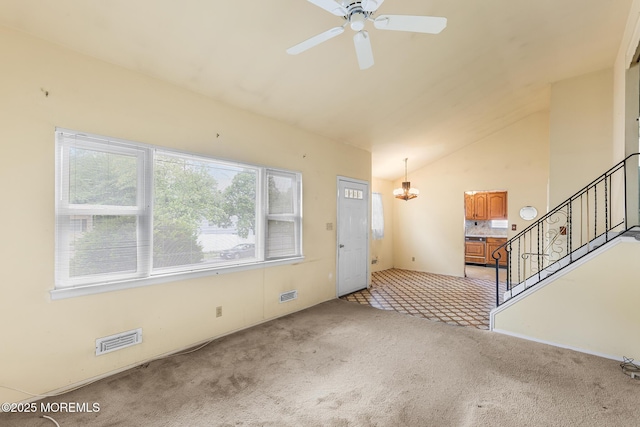 13 Copper Ln, Hazlet, NJ 07730 - unfurnished living room featuring carpet, lofted ceiling, ceiling fan, stairs, and a chandelier
