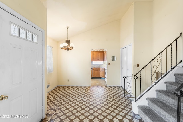 13 Copper Ln, Hazlet, NJ 07730 - entryway featuring a chandelier, stairs, and high vaulted ceiling