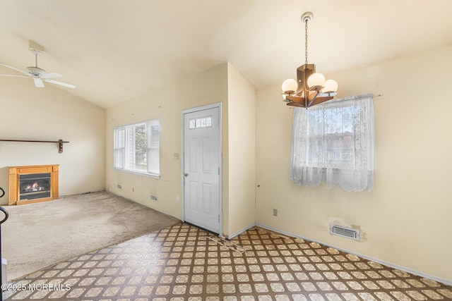 13 Copper Ln, Hazlet, NJ 07730 - foyer entrance featuring lofted ceiling, a lit fireplace, a chandelier, tile patterned floors, and a ceiling fan