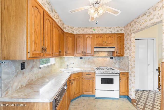 13 Copper Ln, Hazlet, NJ 07730 - kitchen featuring gas range gas stove, under cabinet range hood, ceiling fan, brown cabinets, and wallpapered walls