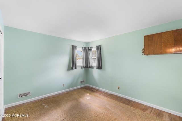 13 Copper Ln, Hazlet, NJ 07730 - spare room featuring wood finished floors and baseboards
