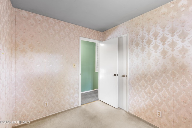 13 Copper Ln, Hazlet, NJ 07730 - empty room with carpet floors and wallpapered walls