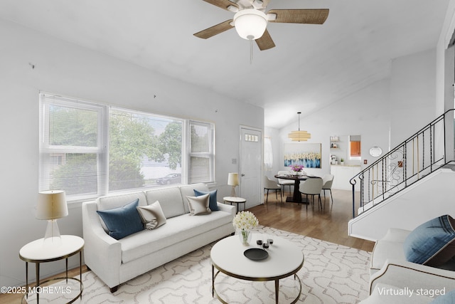 13 Copper Ln, Hazlet, NJ 07730 - living area featuring plenty of natural light, wood finished floors, ceiling fan, stairs, and high vaulted ceiling