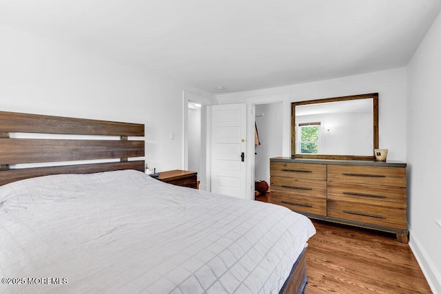 208 E Bergen Pl, Red Bank, NJ 07701 - bedroom featuring wood finished floors and baseboards