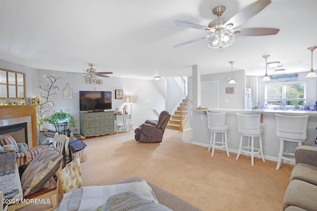 19 Corpus Cristi Bay Ct, Little Egg Harbor, NJ 08087 - living room featuring ceiling fan, stairs, light colored carpet, a glass covered fireplace, and baseboards