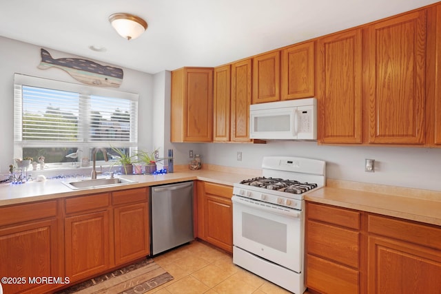 19 Corpus Cristi Bay Ct, Little Egg Harbor, NJ 08087 - kitchen featuring white appliances, a sink, light countertops, and light tile patterned floors