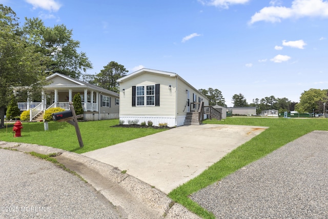 5 Pigeon Ct, Whiting, NJ 08759 - view of side of property with concrete driveway, a porch, and a yard