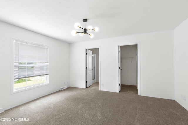 5 Pigeon Ct, Whiting, NJ 08759 - unfurnished bedroom with carpet flooring, a chandelier, a spacious closet, a closet, and baseboards