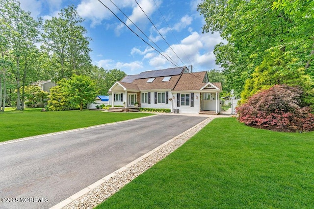 145 Docare Rd, Jackson, NJ 08527 - view of front of home featuring solar panels, driveway, and a front yard
