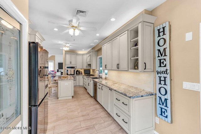 145 Docare Rd, Jackson, NJ 08527 - kitchen with a ceiling fan, oven, light stone counters, backsplash, and recessed lighting
