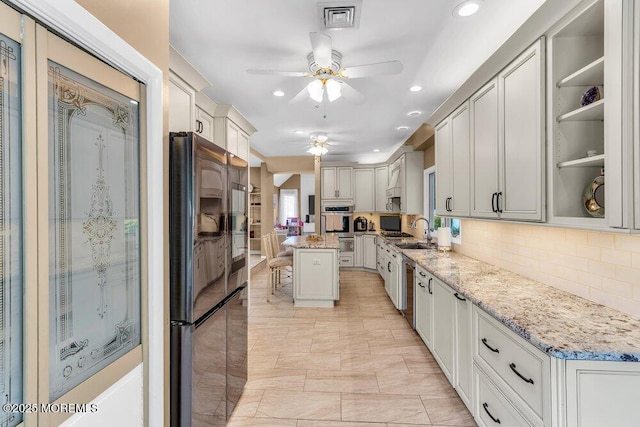 145 Docare Rd, Jackson, NJ 08527 - kitchen with freestanding refrigerator, a ceiling fan, a sink, decorative backsplash, and recessed lighting