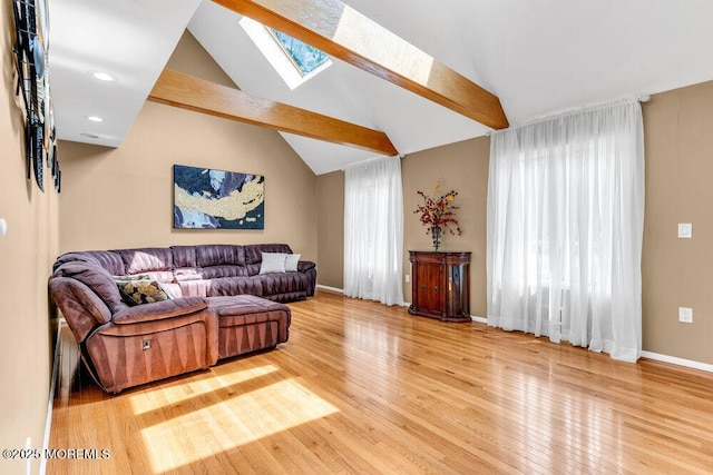 145 Docare Rd, Jackson, NJ 08527 - living room with a skylight, vaulted ceiling, wood finished floors, baseboards, and recessed lighting