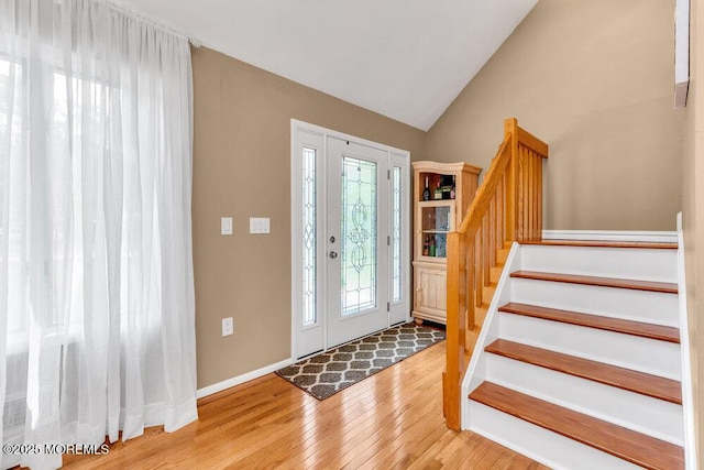 145 Docare Rd, Jackson, NJ 08527 - entryway with wood finished floors, stairway, vaulted ceiling, and baseboards