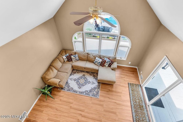 145 Docare Rd, Jackson, NJ 08527 - living room with wood finished floors, a ceiling fan, a towering ceiling, and baseboards