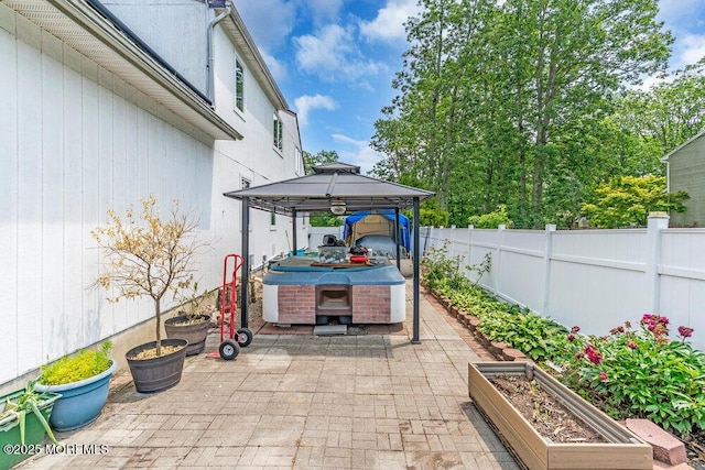 145 Docare Rd, Jackson, NJ 08527 - fenced backyard with a gazebo, a hot tub, a patio, and a garden