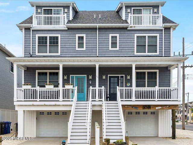 29 7th Ave Unit B, Seaside Heights, NJ 08751 - coastal home featuring an attached garage, a porch, stairway, and a balcony