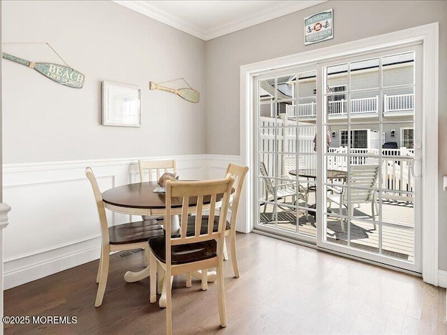 29 7th Ave Unit B, Seaside Heights, NJ 08751 - dining area with ornamental molding, wood finished floors, a wainscoted wall, and a decorative wall