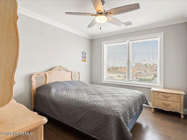 29 7th Ave Unit B, Seaside Heights, NJ 08751 - bedroom with multiple windows, ornamental molding, wood finished floors, baseboards, and ceiling fan