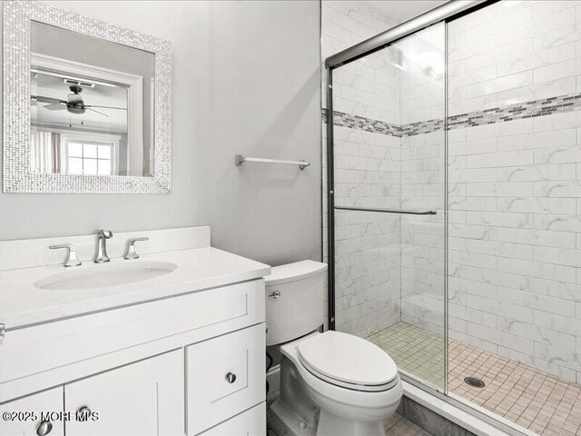 29 7th Ave Unit B, Seaside Heights, NJ 08751 - full bath with a stall shower, toilet, vanity, and ceiling fan